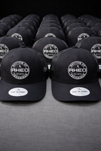RHEO Seal of Greatness Trucker Hat